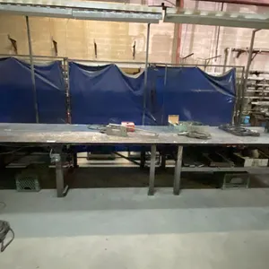 1/4" THICK TOP LARGE METAL SHOP TABLE APPROX 18' 10"L X 4'D X 3'H WITH MOUNTED POWER OUTLET,
