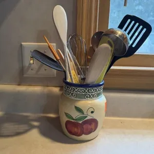 Apple crock of utensils