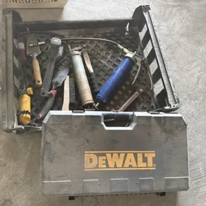 Assorted hand tools, empty DeWalt box, grease