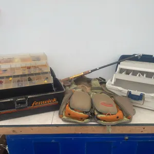 Fishing vest and a pair of tackle boxes with contents