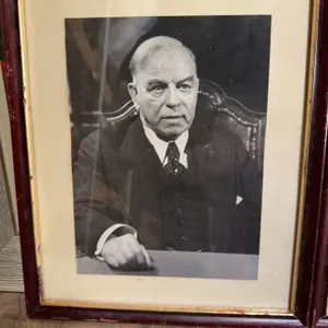 Framed picure of former Canadian Prime Minister William Lyon MacKenzie King   in formal attire, seat