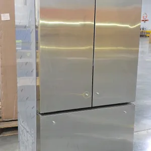 Monogram ZWE23NSTCSS stainless steel built-in French door refrigerator. Features a bottom freezer drawer and an internal ice maker. S/N: ZZ505957. Dim