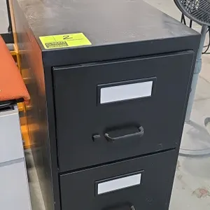 Metal 2-drawer vertical filing cabinet. Features a black finish, integrated pull handles, label holders, and interior drawer dividers.