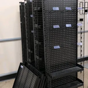 Metal pegboard racks. Features black metal construction with pegboard backs, wire grid side panels, and peg hooks with label holders. Includes detache