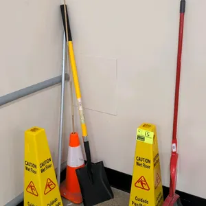 Assorted maintenance supplies. Includes (2) yellow poly 4-sided "Caution Wet Floor" cones, (1) One Stop Gardens 56" square point shovel, (1) orange sa