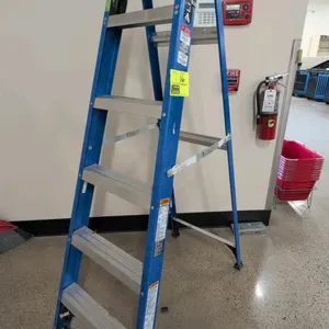 Louisville 6' fiberglass step ladder. Features blue fiberglass rails with SHOXT impact absorption, aluminum rungs, and a black top cap with tool slots