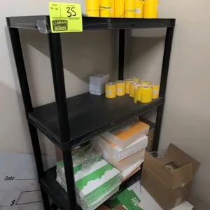 Poly 4-tier shelving rack. Includes shelf contents such as Zebra thermal labels, paper, and supplies. Dimensions: 28"x14"x54". Note: Grocery Outlet br