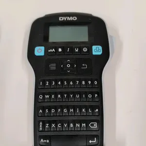 Dymo LabelManager 160e handheld label maker. Features a QWERTY keyboard, LCD display, and one-touch fast-formatting keys. Includes one partially used 