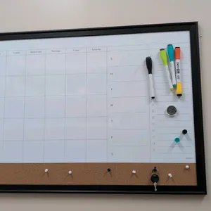 Assorted dry erase boards. Includes (1) U Brands magnetic dry erase calendar board with a cork bottom strip and black frame, (1) large dry erase board