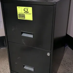 Metal 2-drawer filing cabinet. Features a black finish, integrated drawer pulls, and a lock on the bottom drawer. Dimensions: 15" x 25"H. Note: Key is