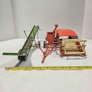 2 vintage pressed steel farm implements