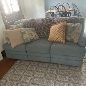 Three cushion reclining couch With pillows and