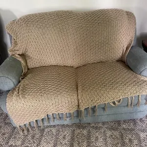 Blue rocking reclining loveseat with Afghan