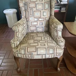 Wing back chair with wooden legs