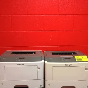 Lexmark MS312dn monochrome laser printer. Features automatic duplexing and network connectivity. Note: Power cords and communication cables are not in
