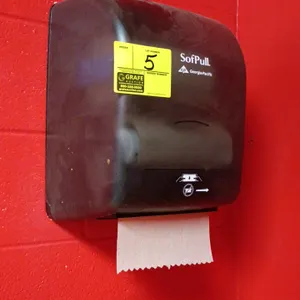 Georgia-Pacific SofPull paper towel dispenser. Features a translucent smoked plastic cover for easy roll monitoring. Wall-mounted design. Mounting har