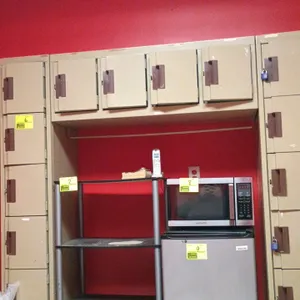 Edsal modular steel locker assembly. Features two 6-tier side towers and a 4-door overhead bridge locker unit with an under-cabinet hanging rod area. 