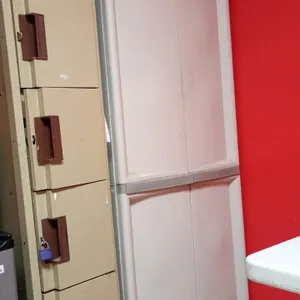 Polypropylene double-door storage cabinet. Features internal shelving. Dimensions: 26" x 63". Contents not included. Lockers and table shown in photos