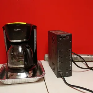 Package lot including a Mr. Coffee 12-cup programmable coffee maker with glass carafe, an uninterruptible power supply (UPS) battery backup unit with 