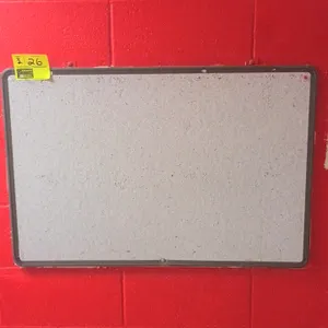 Assorted bulletin board lot. Includes one gray composite board with a dark frame and two cork bulletin boards with wood frames. Note: One cork board h
