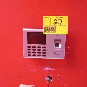 NGTeco electronic biometric time clock. Features integrated fingerprint scanner, LCD display screen, and physical keypad. Includes power adapter. Unit
