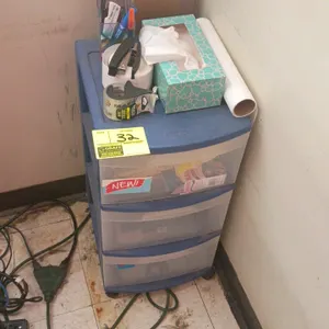 Sterilite plastic 3-drawer mobile storage cart. Features blue frame with translucent drawers. Includes office supply contents on top and inside drawer