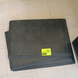 Black rubber anti-fatigue floor mats. Features a textured top surface with a decorative geometric border design and beveled edges. Suitable for commer