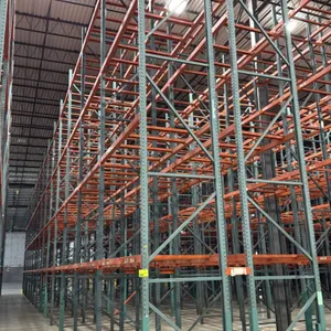 Interack pallet racking. Features green uprights, orange cross beams with teardrop connections, and 3.5" cross bars. Configured with approximately 4-d