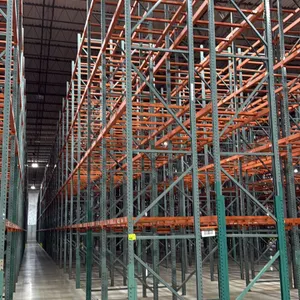 Interack pallet racking system. Includes (66) 8'L, (2) 6'L, and (4) 12'L sections. Features green uprights and orange 3.5" cross bars, configured with