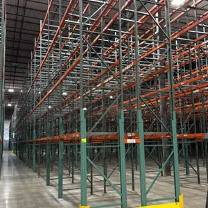 Interack pallet racking system. Features green uprights and orange beams with 3.5" cross bars. Includes (66) 8', (2) 6', and (4) 12' bays. Dimensions: