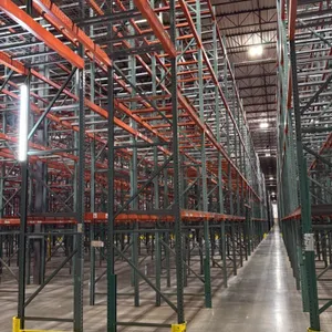 Interack pallet racking system. Includes (130) 8' and (10) 12' sections. Configured with 3'8"D x 26'H green uprights, orange 3.5" crossbars, and wire 