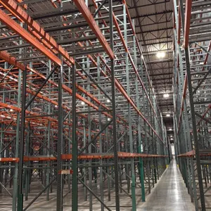 Interack pallet racking system. Includes (130) 8' and (10) 12' sections, measuring 3'8"D x 26'H. Features 3.5" cross bars with approximately 4 decks p