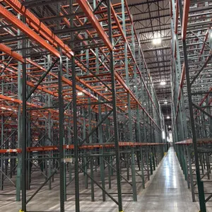 Interack pallet racking system. Features green upright frames, orange step beams with safety clips, and wire mesh decking. Includes (130) 8' and (10) 
