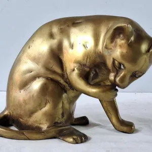 Realistic Brass Cat Licking His Paw Doorstop