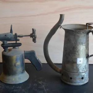 Vintage oil can and antique blow torch