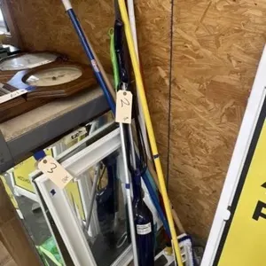 Pile of Mops - Brooms - Cleaning Tools
