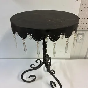 Decorative metal table. 24” high   15 3/4” across