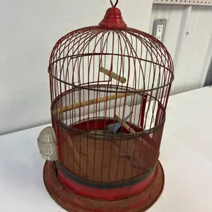 Metal bird cage. 14” high. 12” across