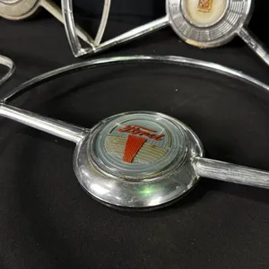 ASSORTED VINTAGE AUTOMOBILE STEERING WHEEL HORN RINGS FEATURING FORD & CADILLAC