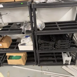 Lab Stands, Black Plastic Shelving, and Boxes
