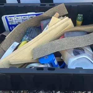 Bin of Drywall and Repair Tools with Quikrete Stucco Patch