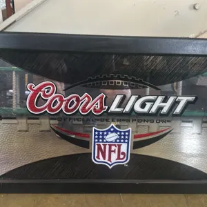 A Coors Light "Official Beer Sponsor" NFL Framed Bar Mirror. (Coors, circa 2000s) An advertising bar mirror featuring the Coors Light logo and the NFL