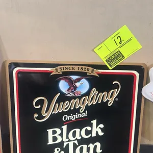 A Yuengling Original Black & Tan Metal Sign. (D.G. Yuengling & Son, Inc., 1996) A metal promotional advertising sign featuring the Yuengling eagle log