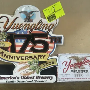 A Pair of Yuengling Metal Beer Signs. (D.G. Yuengling & Son, 2004/Modern) This set includes a die-cut metal 175th Anniversary sign (1829-2004) featuri