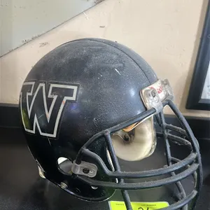 A Vintage WDP ( West DuPere)Football Helmet. (Riddell, 1980s) A collegiate-style football helmet featuring a black shell with white-outlined "W" decal