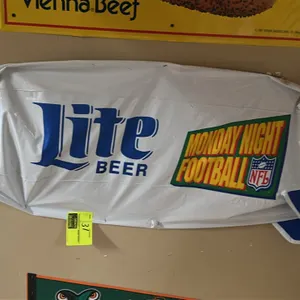 A Miller Lite Beer Inflatable Blimp and Vienna Beef Sign. (Miller / Vienna Beef, 1990s) A promotional advertising lot including a wall-mounted "Lite B
