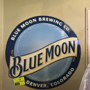 A Pair of Blue Moon and Vienna Beef Metal Advertising Signs. (Blue Moon Brewing Co./Vienna Beef, circa 1997-2000s) A pair of metal signs including a r