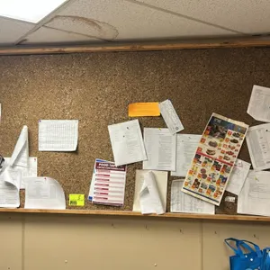 Corkboard with wooden frame. Features a natural cork bulletin surface and a light wood perimeter frame. 96"W x 44"H. Wall-mounted. Contents not includ