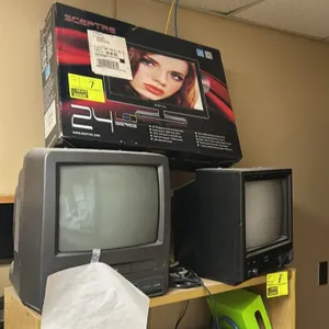 Electronics lot. Includes (1) Sceptre E243BD-FHD 23" LED HDTV with built-in DVD player in box, (1) Symphonic CRT TV/VCR combo, and (1) IMA CRT TV. Not