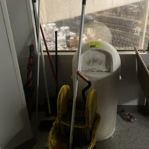 Cleaning equipment and supplies lot. Includes (1) yellow plastic wheeled mop bucket with a down-press wringer and mop, (1) white cylindrical plastic d
